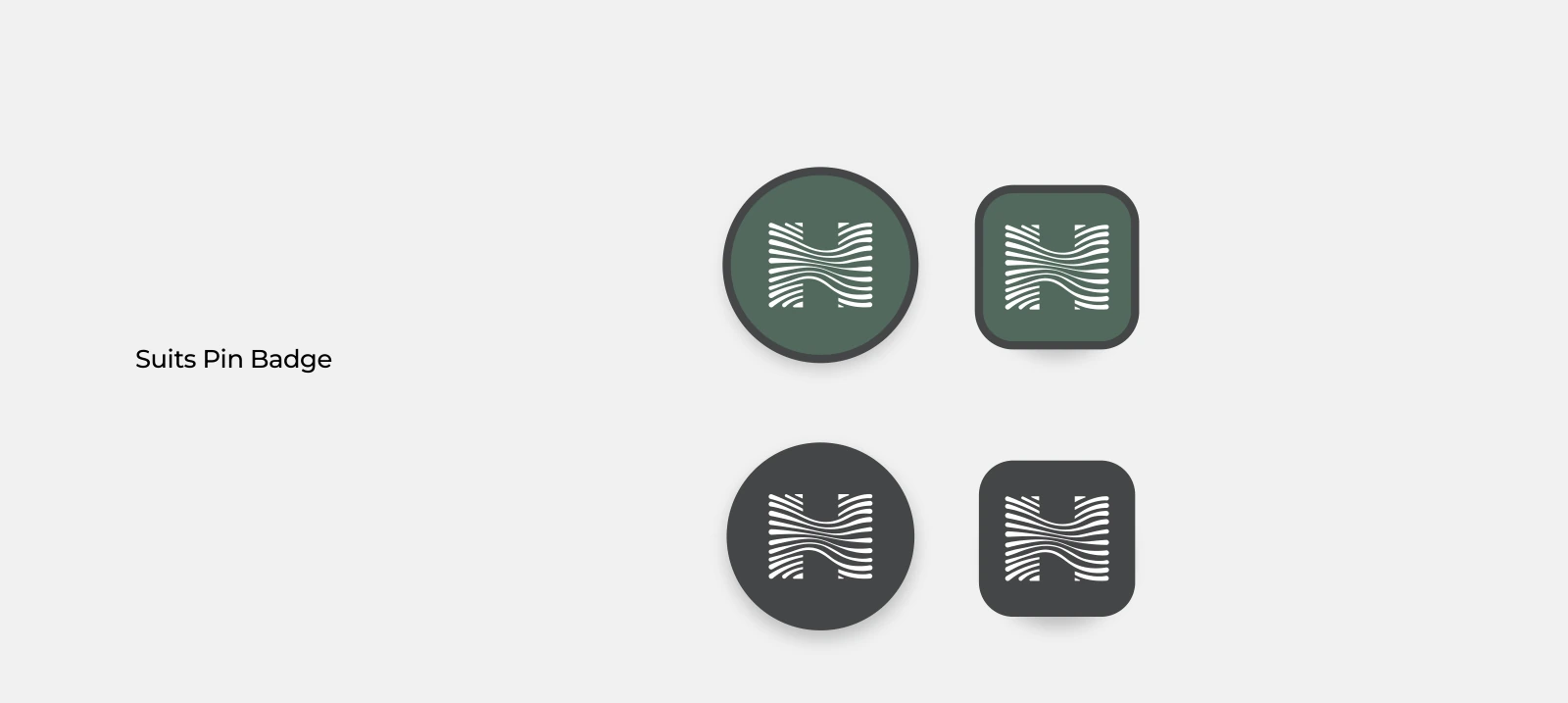 Original Hoonam branded pins in green and neutral finishes