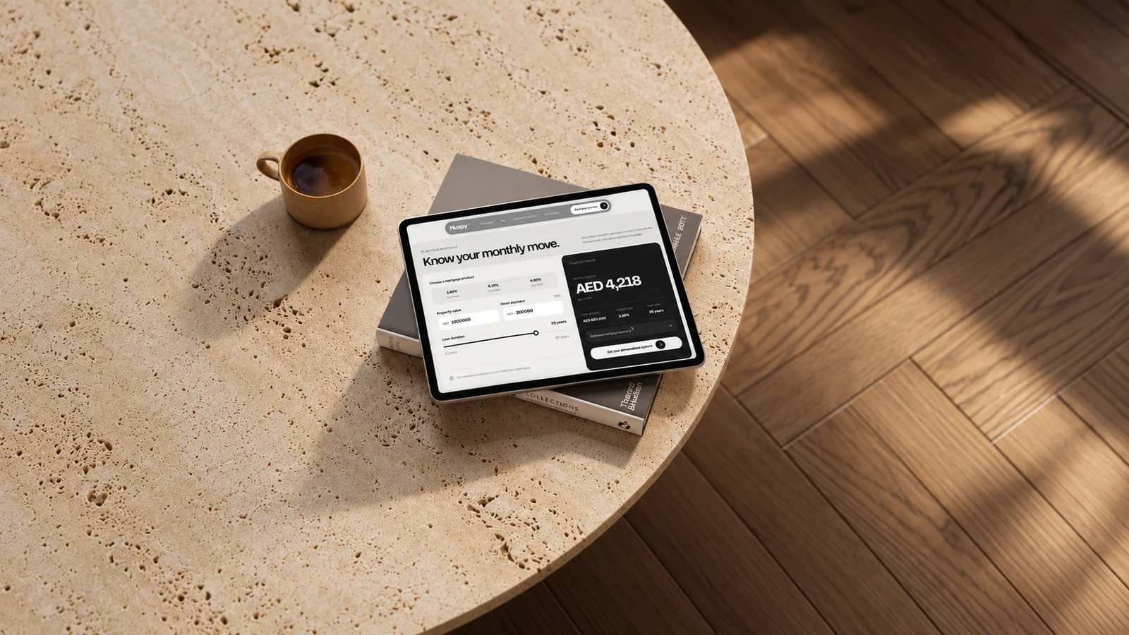 Huspy mortgage calculator on a tablet on a travertine coffee table